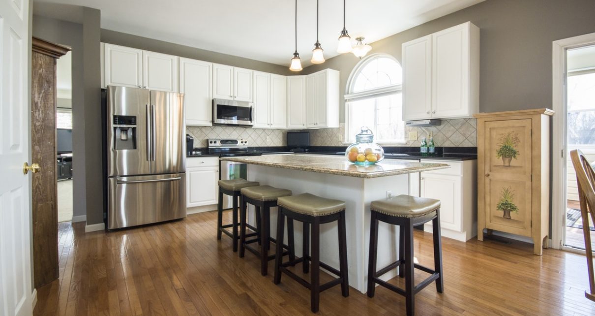 a kitchen with wooden floor